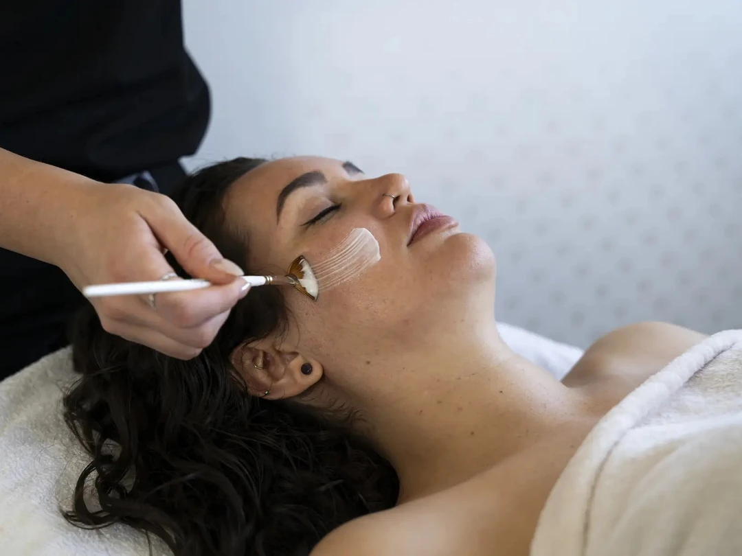 Woman receiving a personalized facial treatment in Belleville, ON