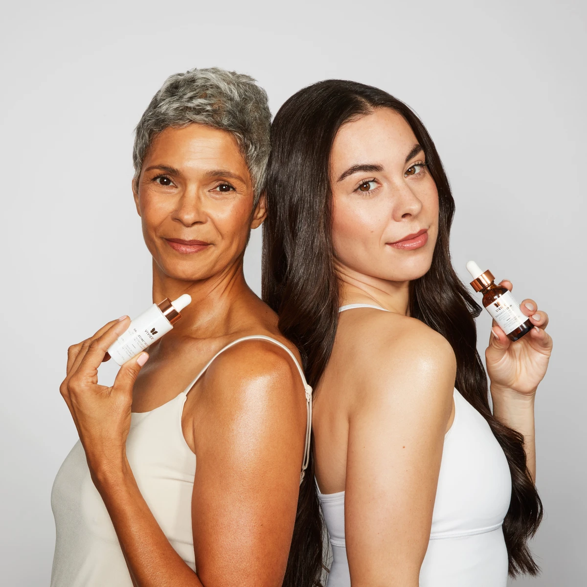 Women holding Vivier Skin Care Prodcuts